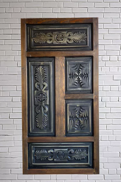 Tête de lit en bois sculpté